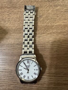 Tissot Silver Watch with White Dial and Roman Numerals